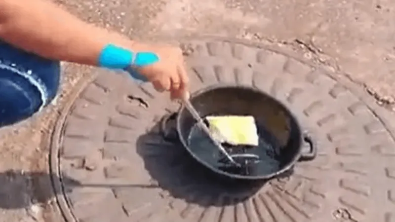 Mulher aproveita calor e frita pastel no chão no Mato Grosso