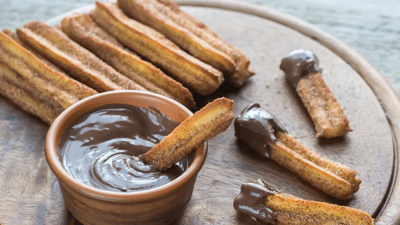 Qual o país de origem do churros?