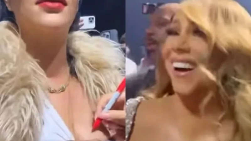 Mariah Carey autografa seio de Rihanna durante show de Natal