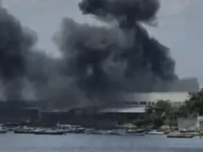 Uma semana após incêndio, moradores da Ilha do Governador reclamam de odor de combustível